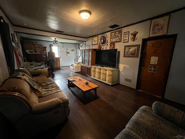 living room with ceiling fan and dark wood-type flooring