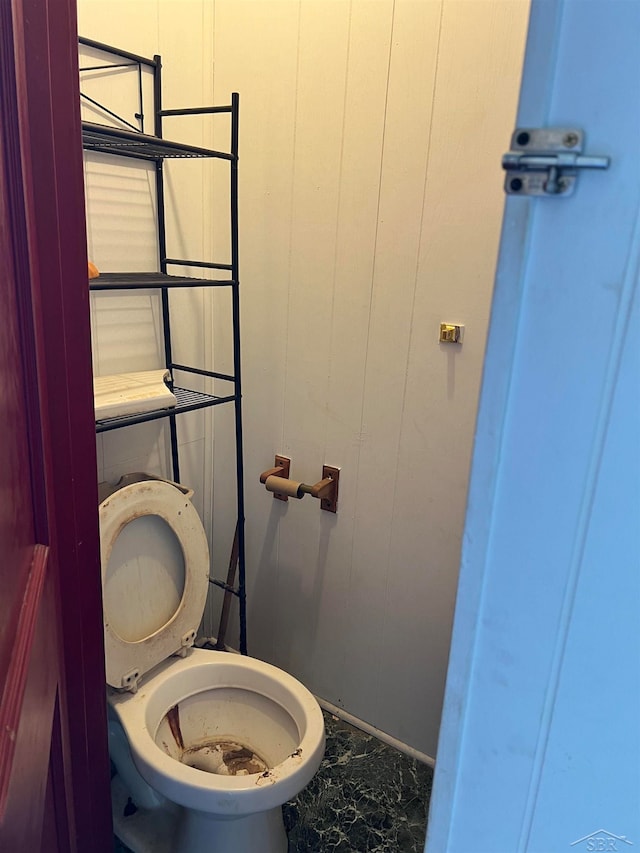 bathroom with tile patterned flooring and toilet