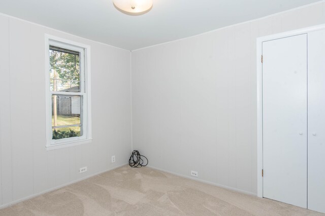 empty room featuring light colored carpet