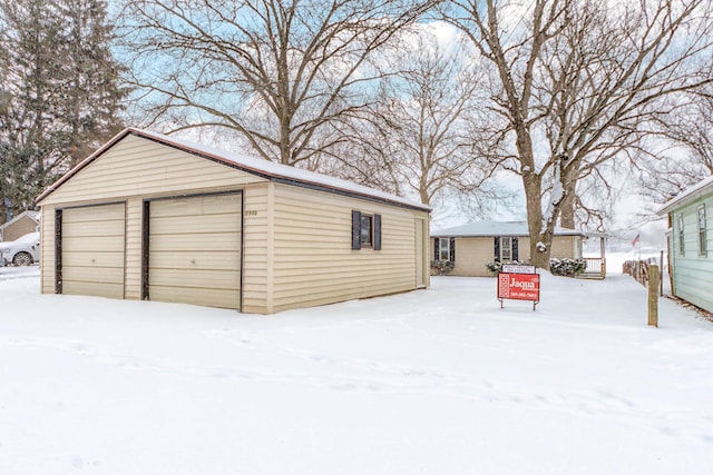 view of snow covered garage