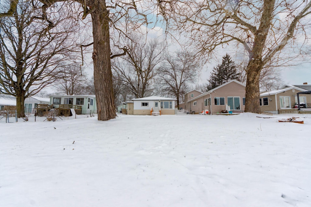 view of yard layered in snow