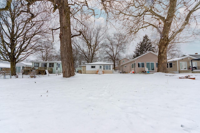 view of yard layered in snow