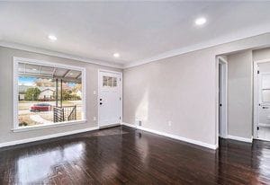 interior space featuring dark hardwood / wood-style flooring and crown molding