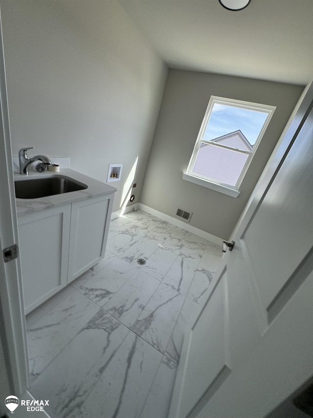 bathroom with marble finish floor, baseboards, visible vents, and vanity