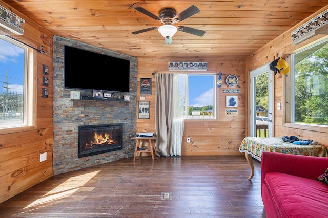 living room with wood walls, dark hardwood / wood-style flooring, and wood ceiling