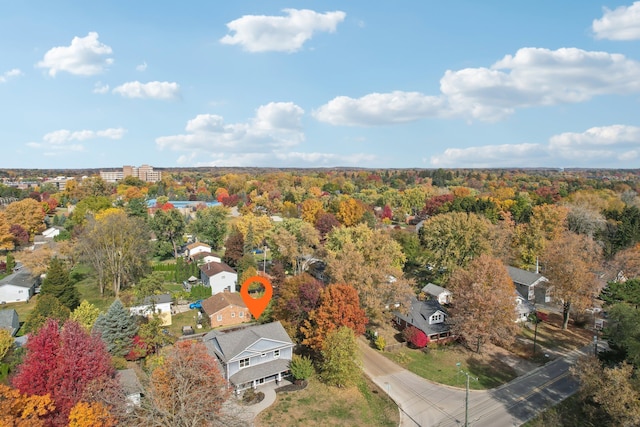 birds eye view of property with a forest view