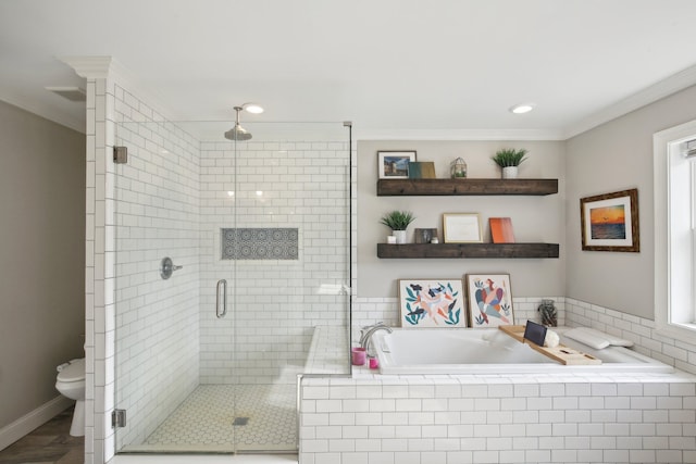 bathroom with a garden tub, toilet, a stall shower, and ornamental molding