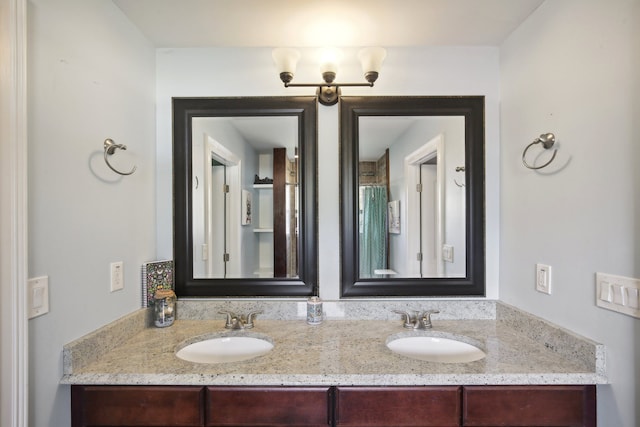 full bath with double vanity and a sink