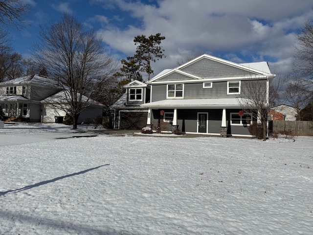 view of front of home with a porch and a garage