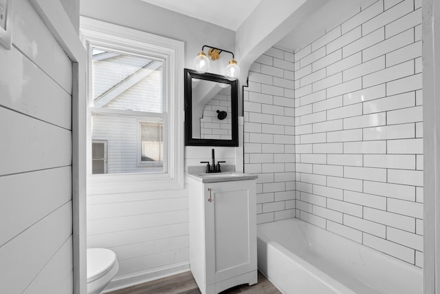 bathroom featuring hardwood / wood-style floors, vanity, and toilet