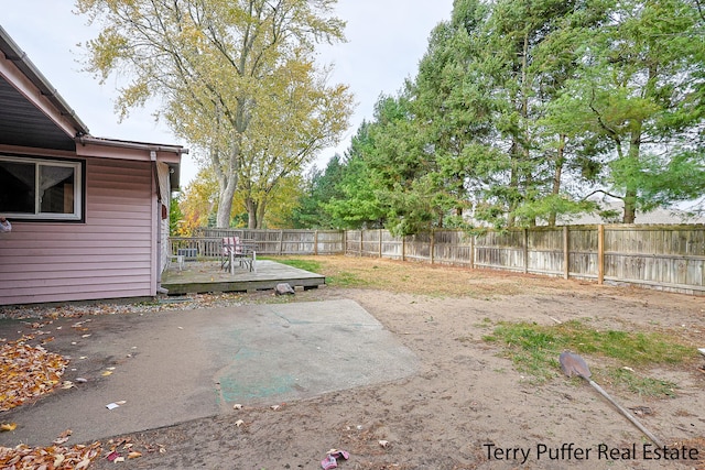 view of yard featuring a wooden deck