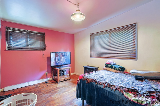 bedroom with light hardwood / wood-style floors