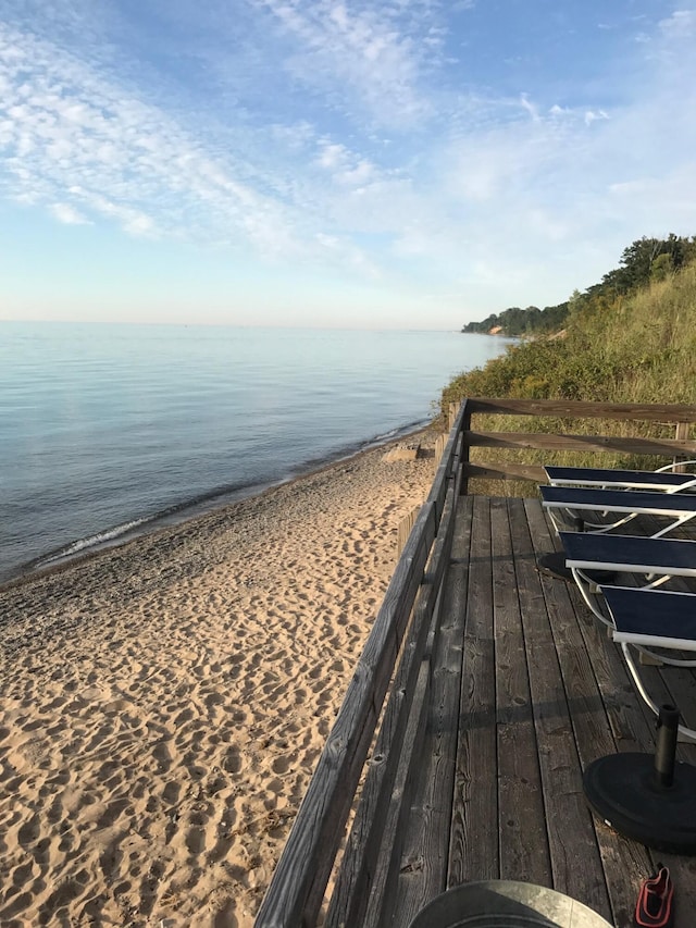 property view of water featuring a beach view