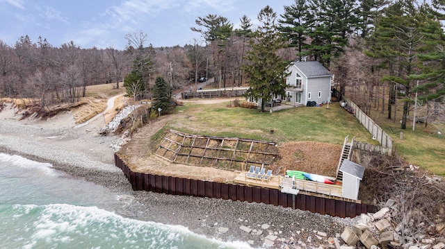 view of yard featuring a deck with water view