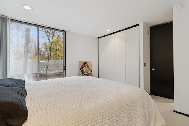 bedroom with light colored carpet