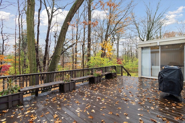 wooden deck featuring area for grilling