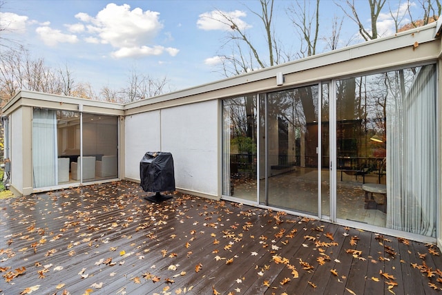 wooden terrace with area for grilling