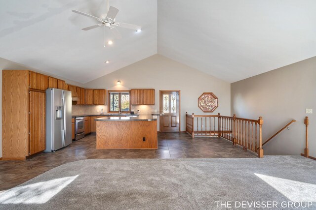 2766 48th Ave, Zeeland, MI 49464 - kitchen with appliances with stainless steel finishes, vaulted ceiling, ceiling fan, open floor plan, and brown cabinets