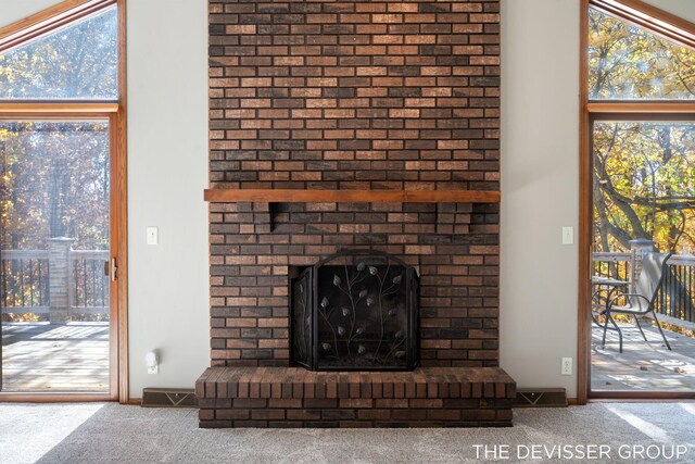 2766 48th Ave, Zeeland, MI 49464 - detailed view of carpet floors and a brick fireplace