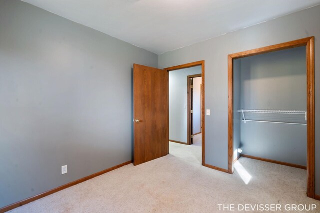 2766 48th Ave, Zeeland, MI 49464 - unfurnished bedroom with carpet, baseboards, and a closet