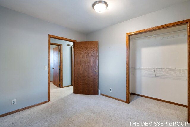 2766 48th Ave, Zeeland, MI 49464 - unfurnished bedroom with carpet, baseboards, and a closet