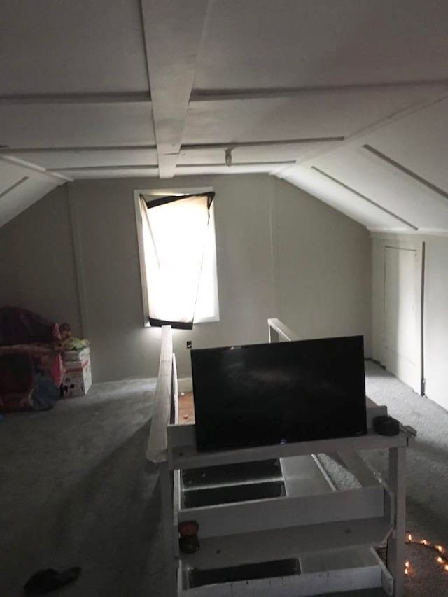 bonus room featuring carpet floors and lofted ceiling