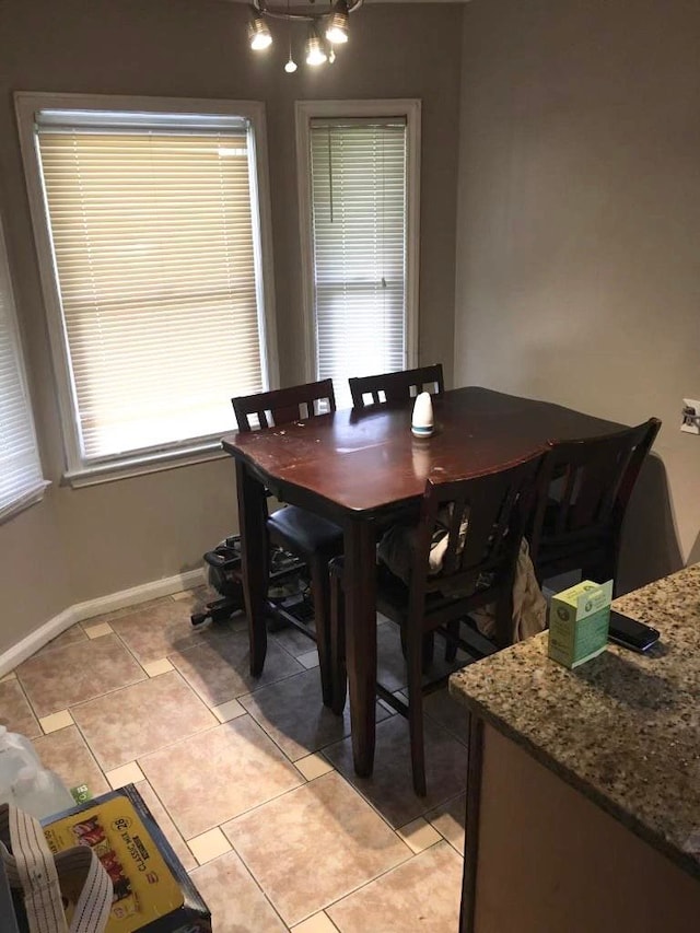 dining room featuring light tile patterned flooring