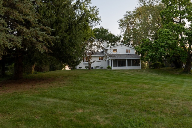 view of yard featuring a sunroom