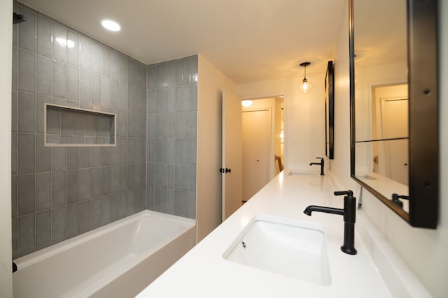 full bath with bathtub / shower combination, double vanity, recessed lighting, and a sink