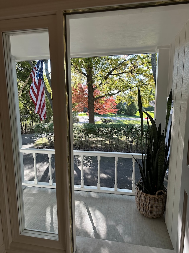 entryway with wood finished floors