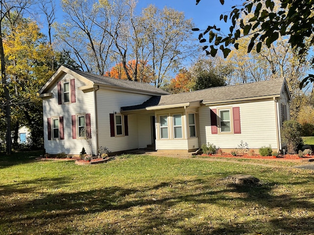 ranch-style home with a front lawn