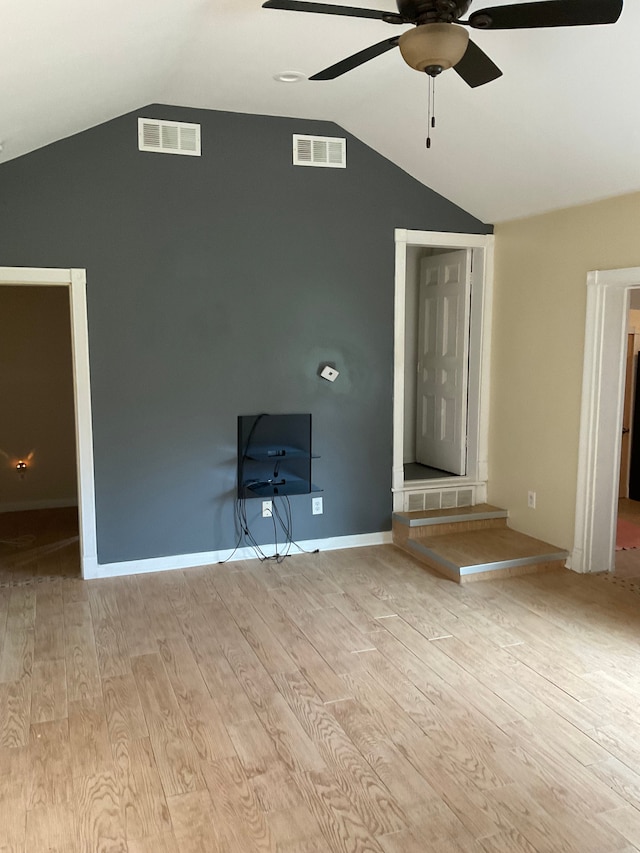 unfurnished living room with ceiling fan, light hardwood / wood-style flooring, and lofted ceiling