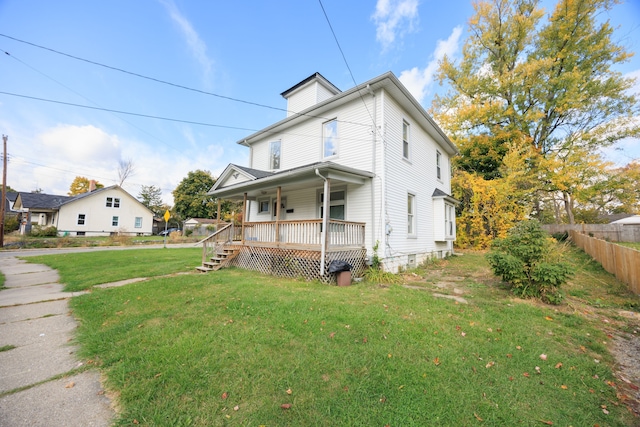 view of front of house featuring a front lawn and a porch