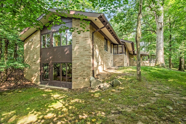 view of home's exterior featuring a lawn