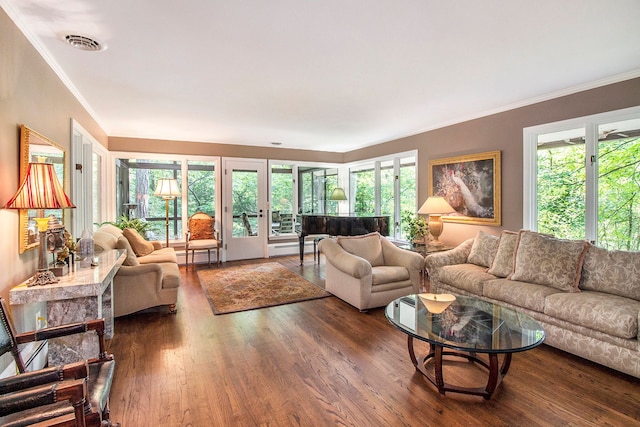 living room with dark hardwood / wood-style flooring, ornamental molding, and baseboard heating