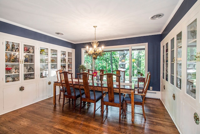 dining space with ornamental molding, dark hardwood / wood-style floors, and an inviting chandelier