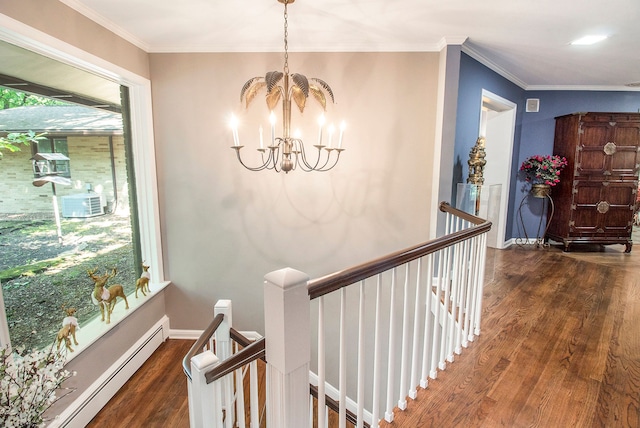 hall featuring crown molding, a baseboard radiator, dark hardwood / wood-style floors, and a notable chandelier