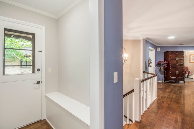 interior space with dark hardwood / wood-style flooring and ornamental molding