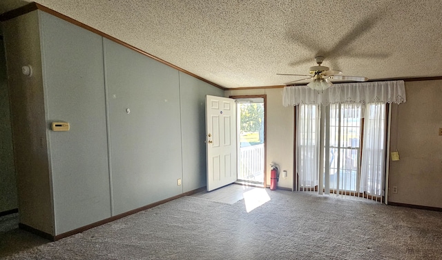 interior space with ceiling fan, crown molding, and a textured ceiling