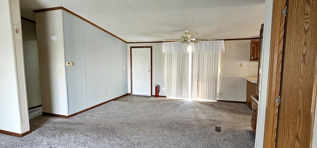 unfurnished room with carpet, a textured ceiling, and ceiling fan