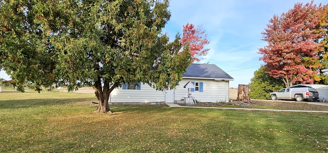 view of home's exterior with a yard