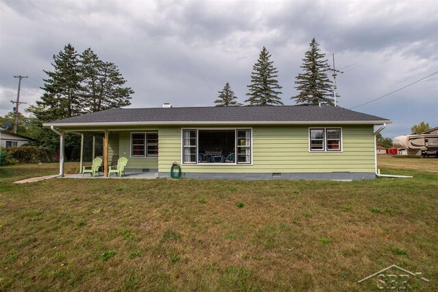 4029 Cobblestone Ct, Beaverton, MI 48612 - rear view of house with a patio area and a yard