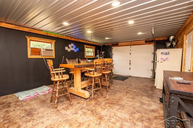 4029 Cobblestone Ct, Beaverton, MI 48612 - dining room with concrete flooring, recessed lighting, and healthy amount of natural light