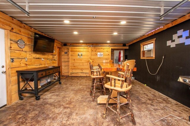 4029 Cobblestone Ct, Beaverton, MI 48612 - dining area with recessed lighting, wood walls, carpet, and cooling unit
