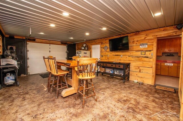 4029 Cobblestone Ct, Beaverton, MI 48612 - dining space with recessed lighting and a wood stove