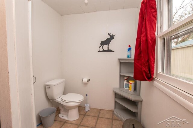 4029 Cobblestone Ct, Beaverton, MI 48612 - bathroom with toilet and tile patterned floors