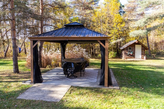 view of property's community with a gazebo and a yard