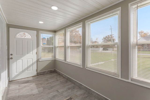 unfurnished sunroom featuring wooden ceiling