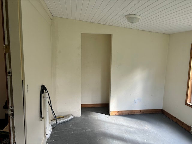 unfurnished room featuring wood ceiling