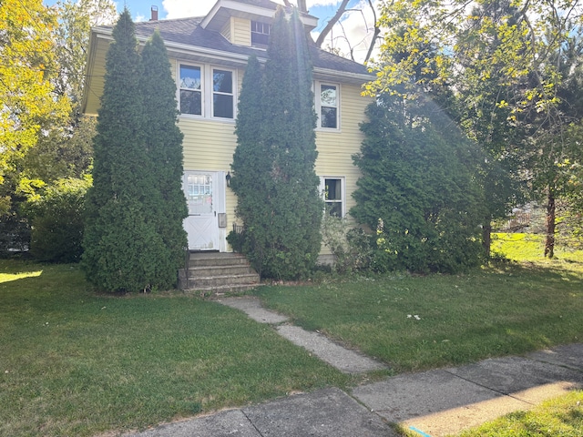 view of home's exterior with a yard